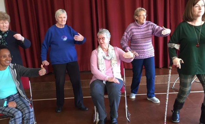 Tai Chi Class sitting and standing